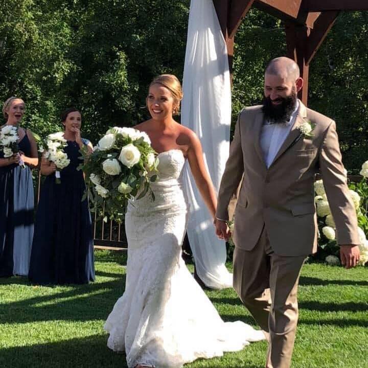Couple walking down aisle after wedding